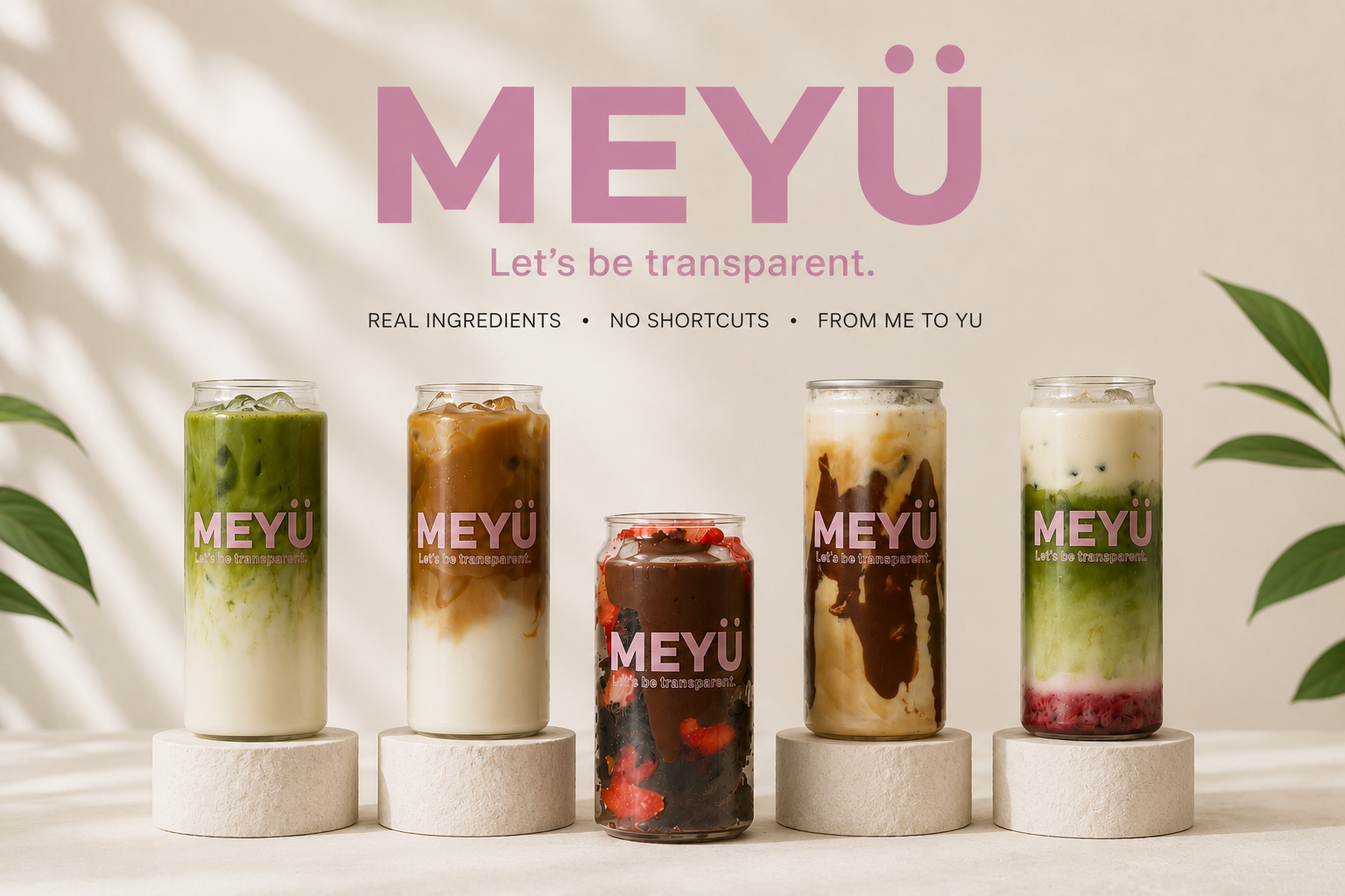 MEYÜ. Let's be transparent. Real ingredients, no shortcuts, from me to yu. Five iced matcha and iced coffee cans on display.